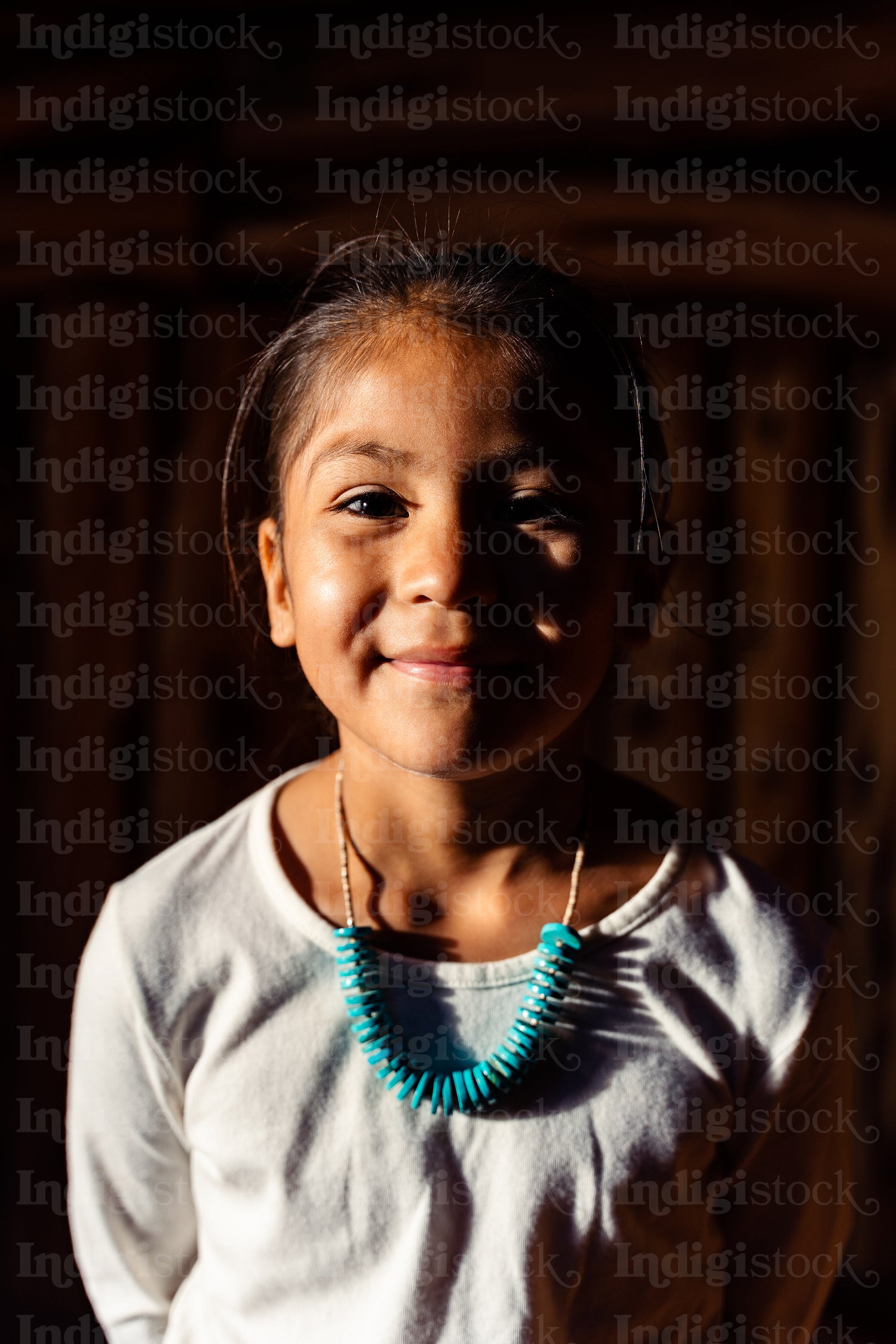 Native American children wearing traditional regalia 