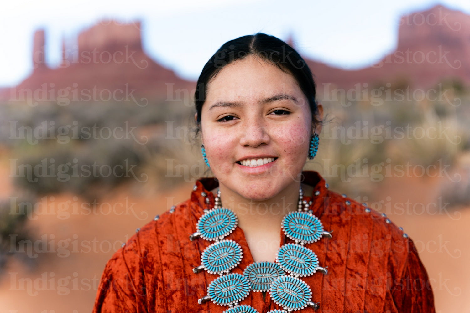 Young Native youth wearing traditional clothing and regalia outs