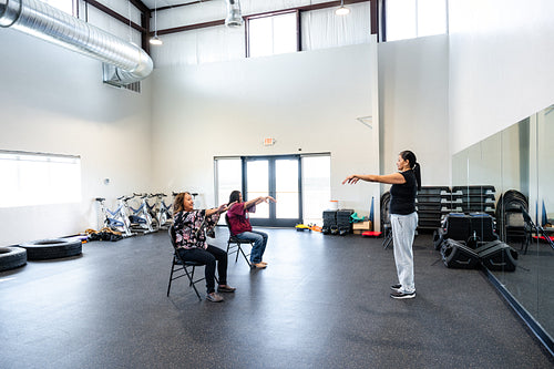 Native woman learning from an instructor