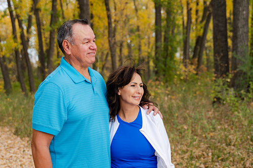 Middle aged Native couple taking a walk through the woods