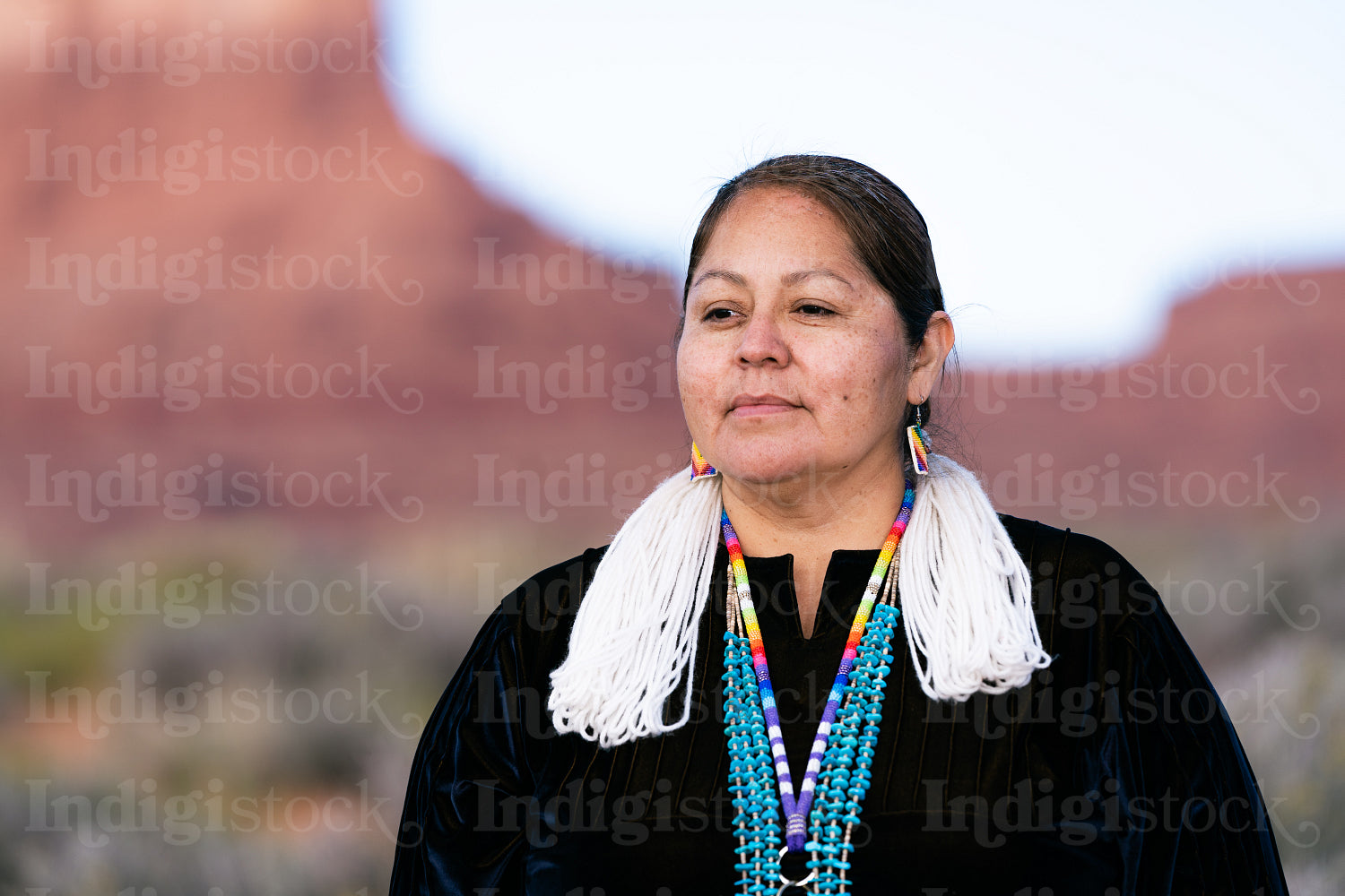 A Native woman wearing traditional regalia 