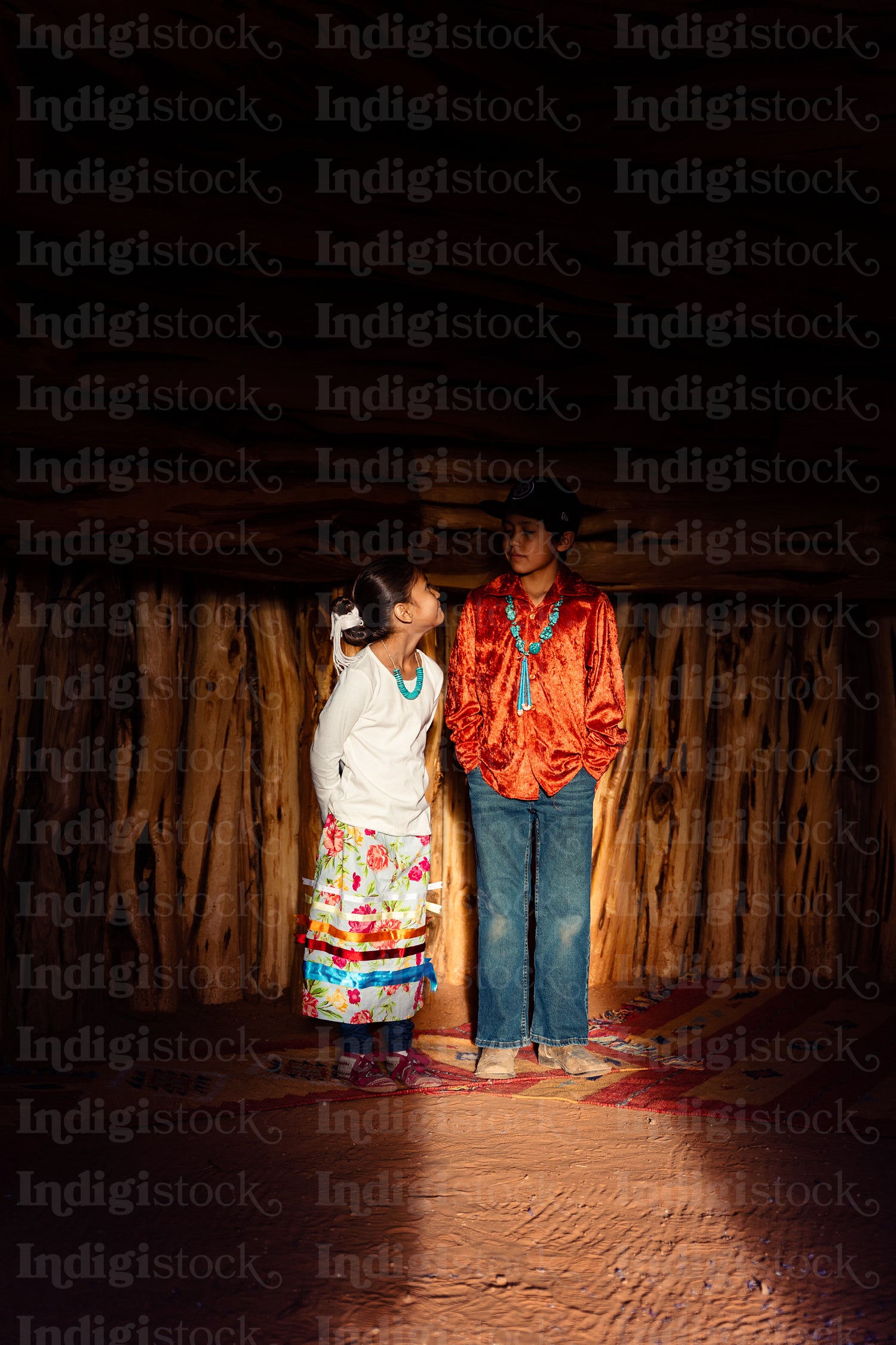 Native American children wearing traditional regalia 