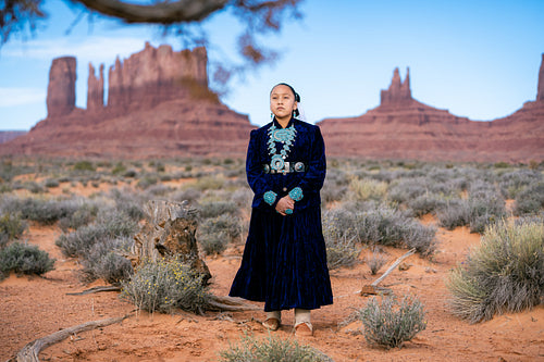 Native youth wearing traditional clothing and regalia