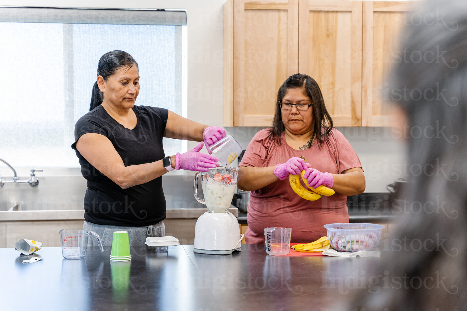 Native Peoples participating in a cooking class