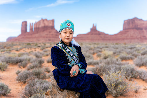 Native youth wearing traditional clothing and regalia