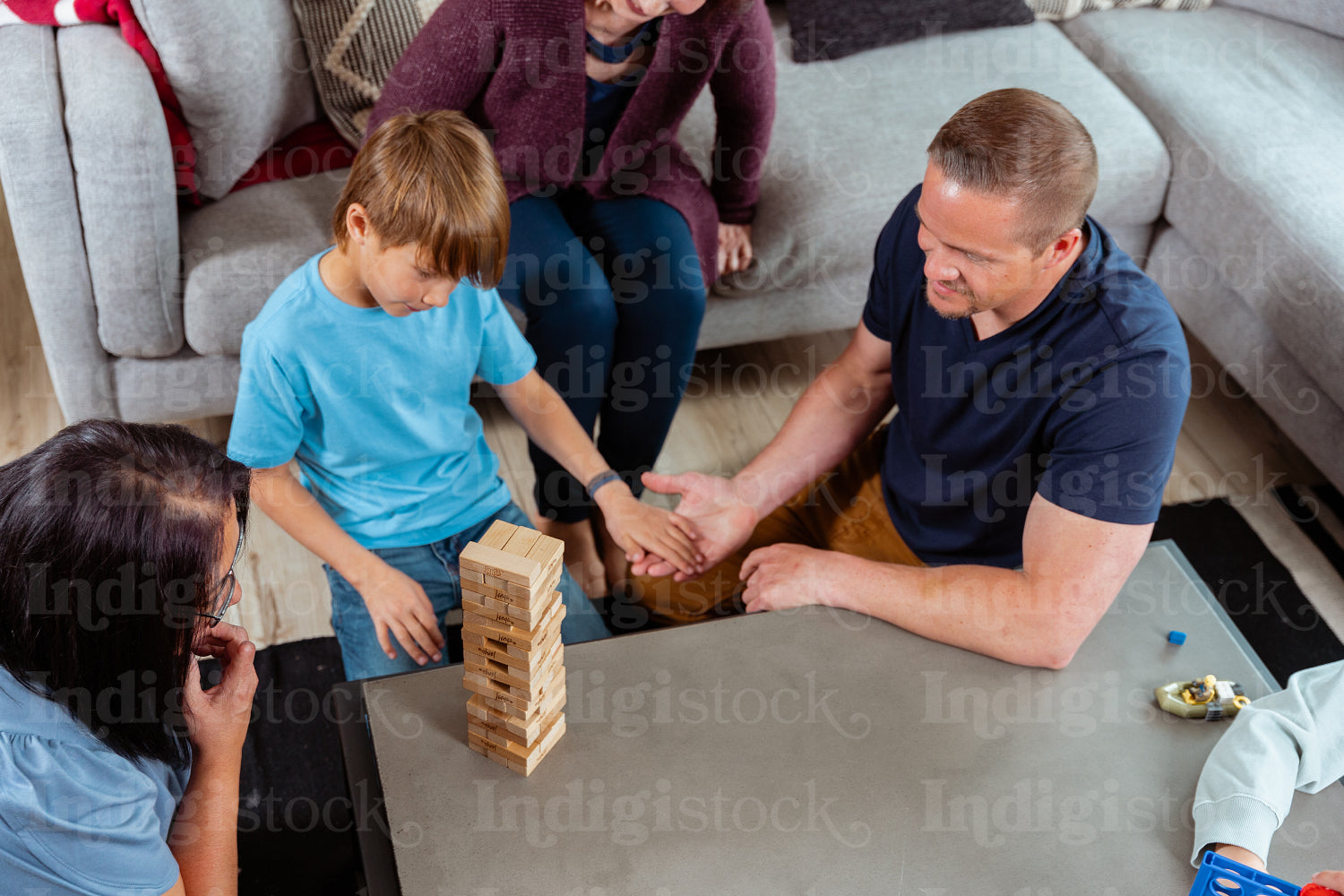 A family of Indigenous Peoples playing games together