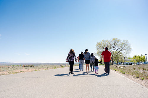 A Native family going on a walk outside