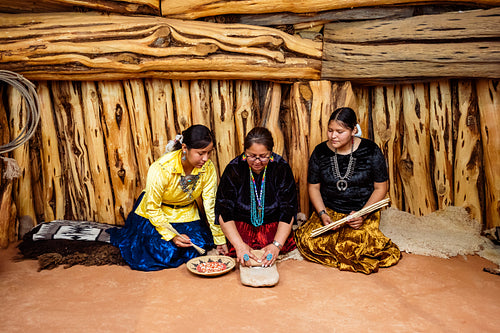 Native Women grinding corn