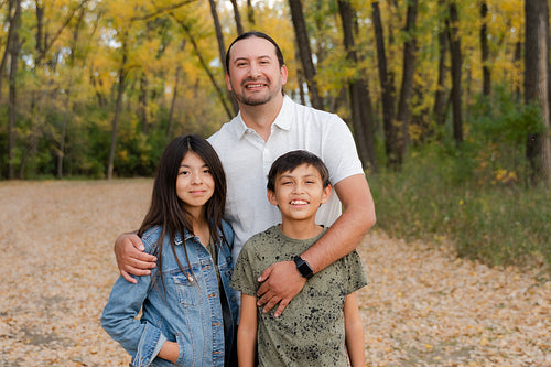 Indigenous family taking a walk in the woods