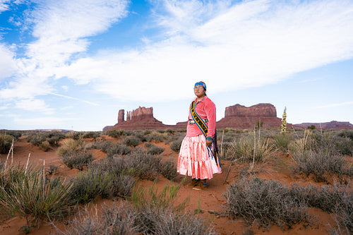 Young Native youth wearing traditional clothing and regalia outs