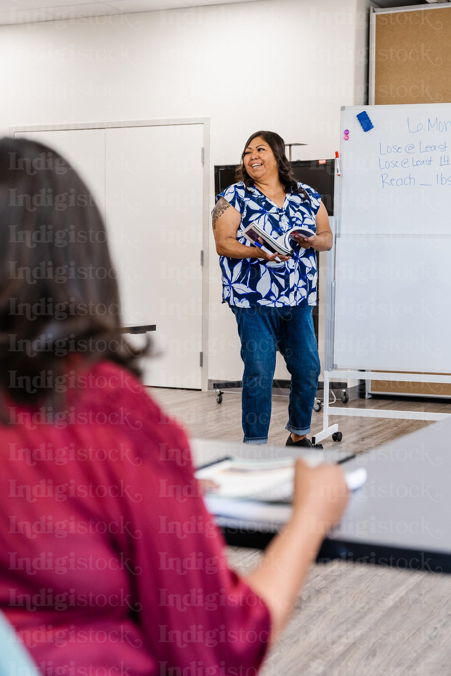 A native teacher instructing a class about health and wellness