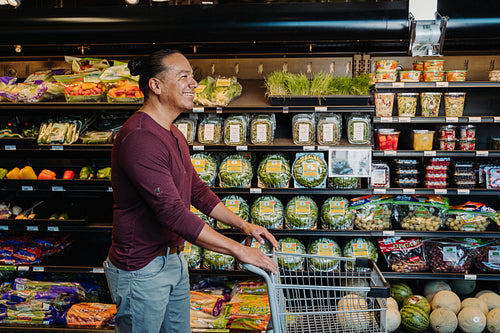 Indigenous man grocery shopping