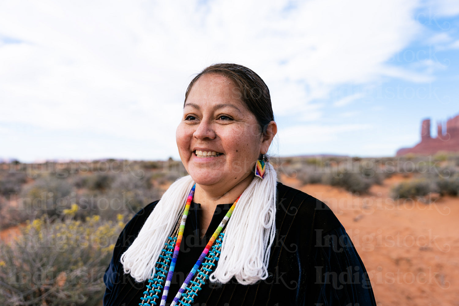 A Native woman wearing traditional regalia 