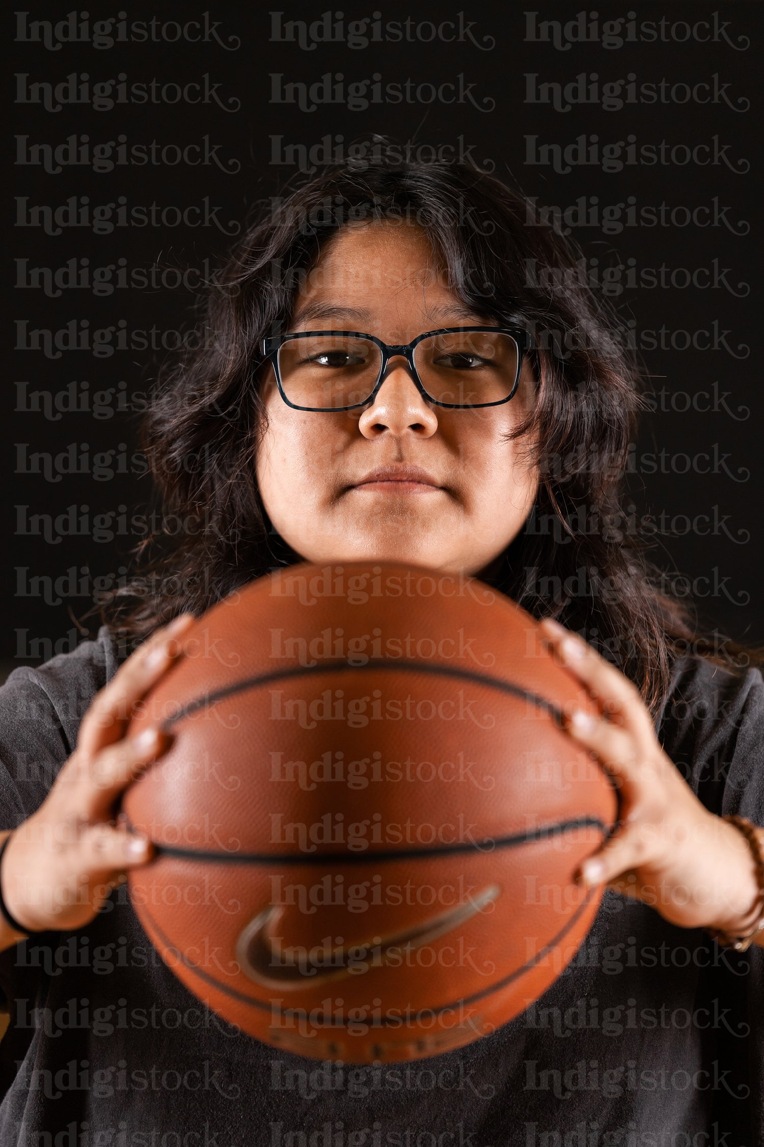 Native youth playing basketball