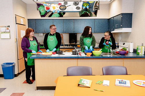 Indigenous Peoples making a meal together