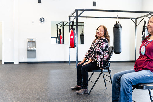 Native woman learning from an instructor