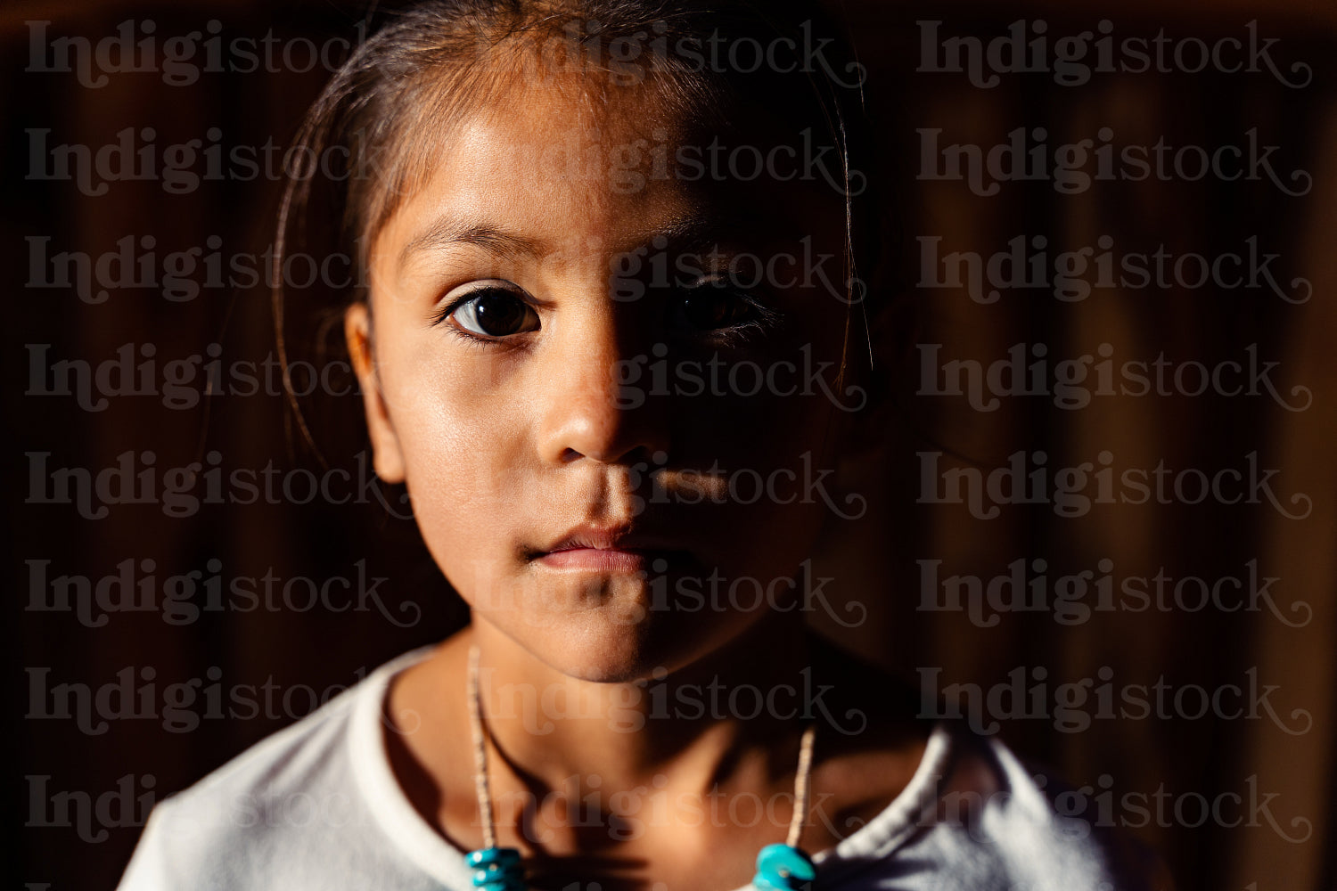 Native American children wearing traditional regalia 