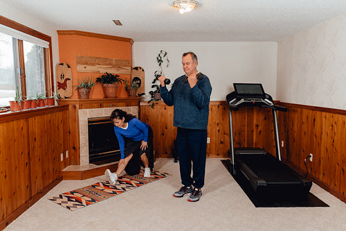 Indigenous couple working out in their home gym