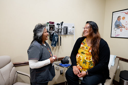 A native woman getting checked by an indigenous nurse