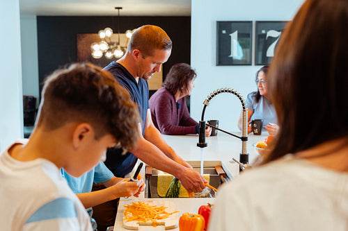 A Native family is preparing a meal together