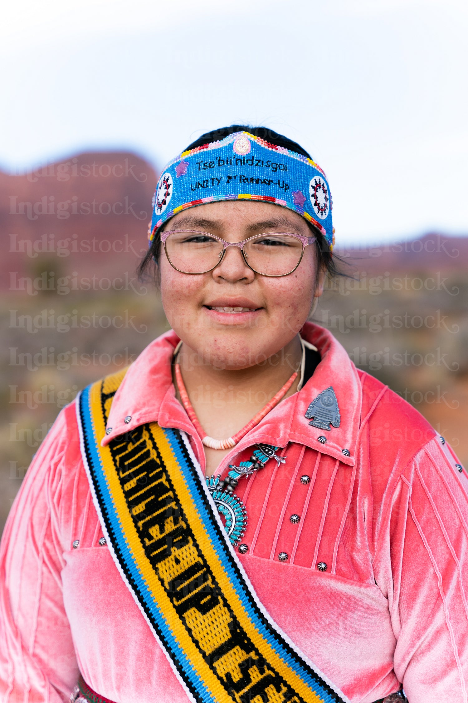 Young Native youth wearing traditional clothing and regalia outs