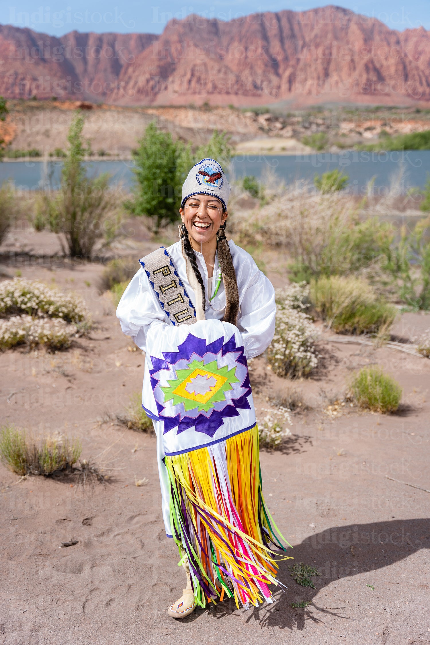 A young Native woman in traditional clothing and regalia 