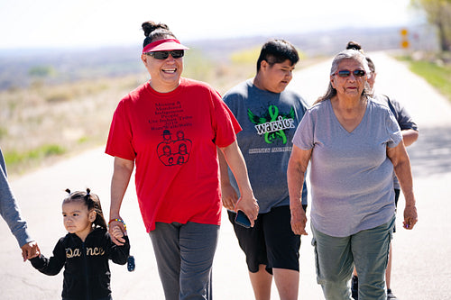 A Native family going on a walk outside