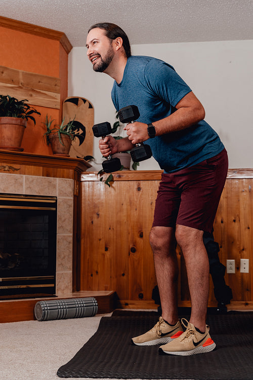 Indigenous Men working out in home gym