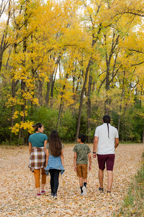 Indigenous family taking a walk in the woods