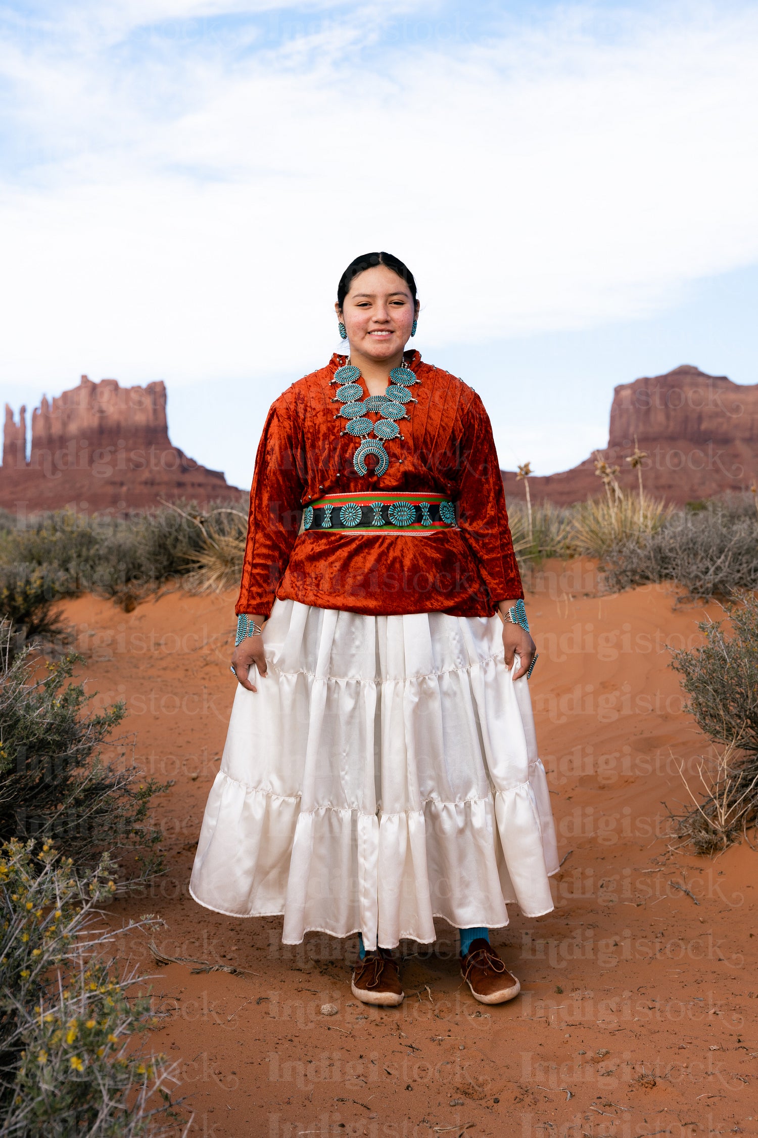 Young Native youth wearing traditional clothing and regalia outs